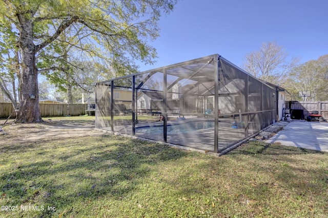 exterior space with a fenced backyard, a lanai, a lawn, a fenced in pool, and a patio area