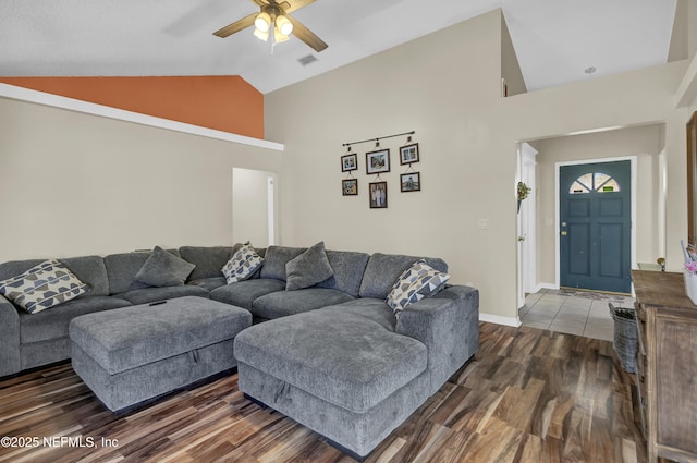 living room with visible vents, dark wood finished floors, baseboards, and ceiling fan