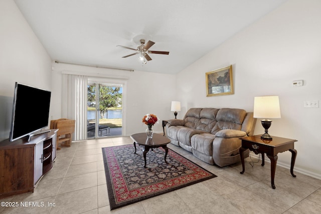 living room with lofted ceiling, light tile patterned floors, ceiling fan, and baseboards