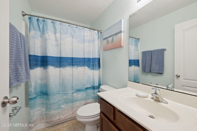 full bathroom featuring a textured ceiling, vanity, toilet, and tile patterned floors