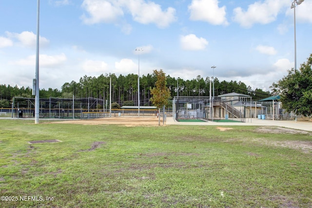 view of community with fence and a yard