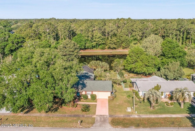 drone / aerial view featuring a view of trees