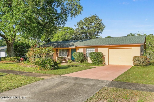 ranch-style house with a garage, concrete driveway, and a front lawn