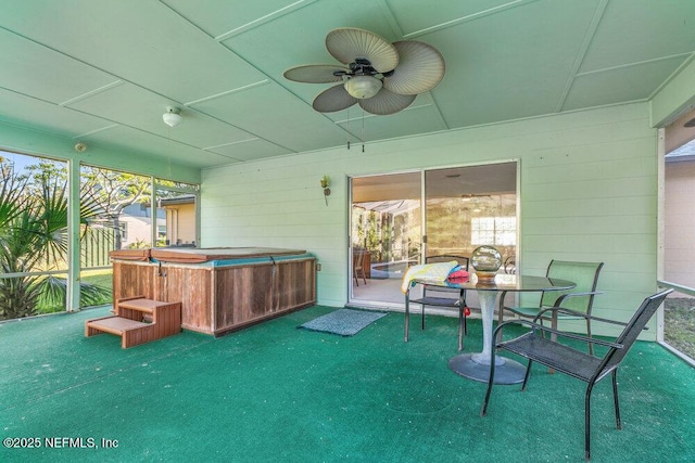 sunroom with a healthy amount of sunlight and a ceiling fan