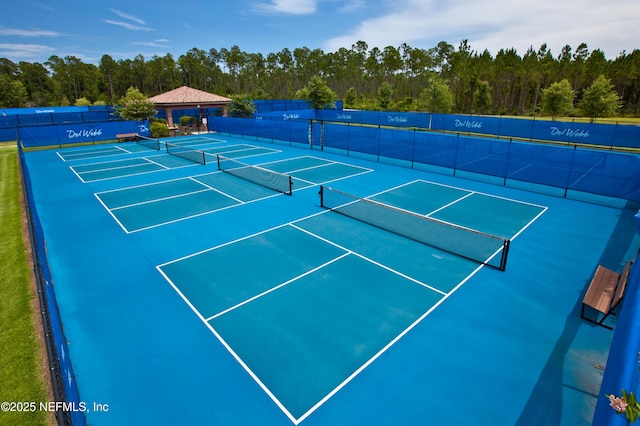 view of tennis court with fence