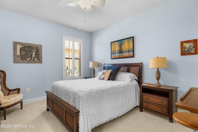 bedroom with baseboards, light colored carpet, and a ceiling fan