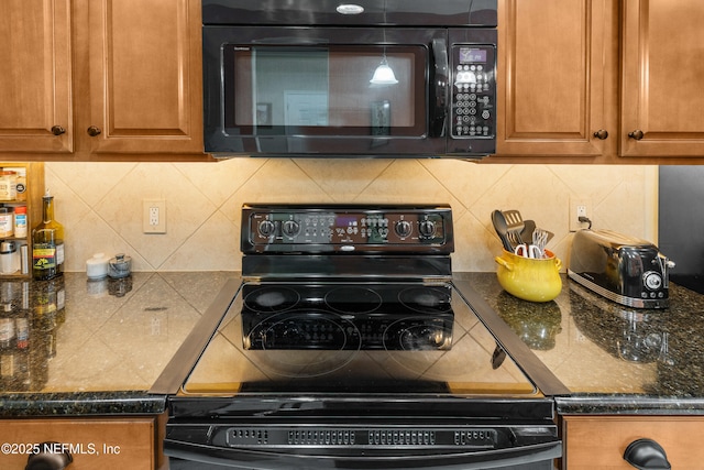 kitchen with tasteful backsplash, black appliances, and brown cabinetry