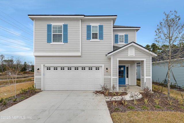 view of front of property featuring concrete driveway and an attached garage