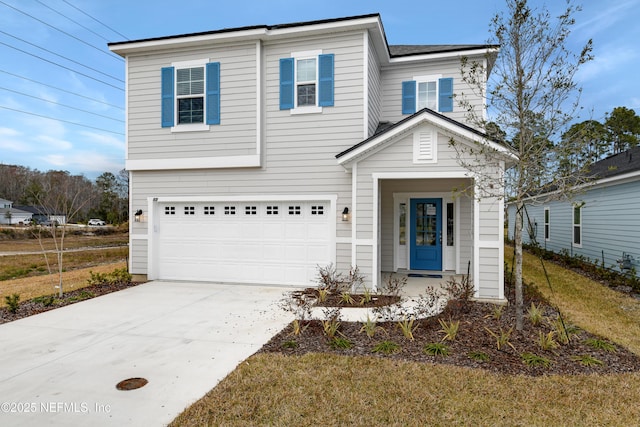 traditional-style home with concrete driveway and an attached garage