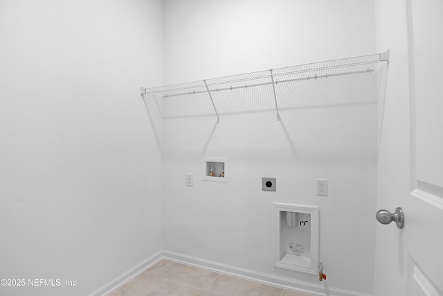 laundry room with laundry area, hookup for a washing machine, baseboards, and electric dryer hookup