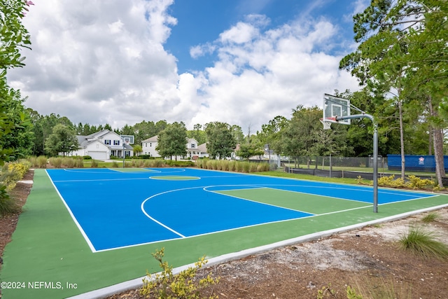 view of sport court featuring community basketball court and fence