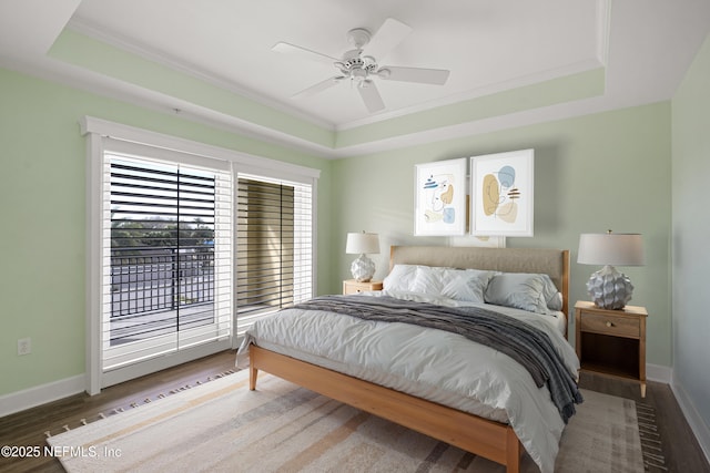 525 3rd St N Unit 303, Jacksonville Beach, FL 32250 - bedroom featuring a tray ceiling, wood finished floors, and baseboards