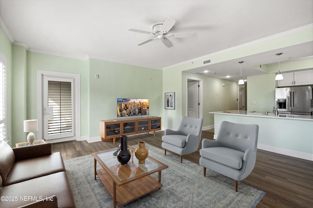 525 3rd St N Unit 303, Jacksonville Beach, FL 32250 - living area with ceiling fan, baseboards, dark wood-style flooring, and ornamental molding