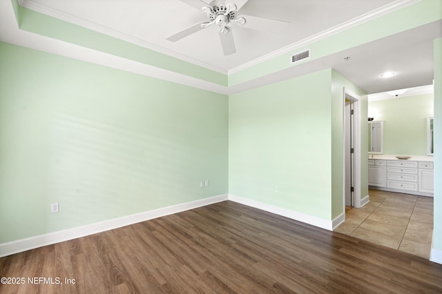 525 3rd St N Unit 303, Jacksonville Beach, FL 32250 - unfurnished bedroom with visible vents, crown molding, baseboards, and wood finished floors