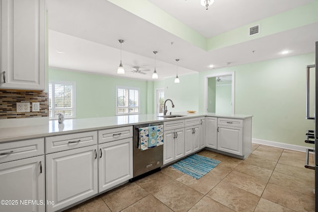 525 3rd St N Unit 303, Jacksonville Beach, FL 32250 - kitchen with a sink, visible vents, white cabinets, light countertops, and stainless steel dishwasher