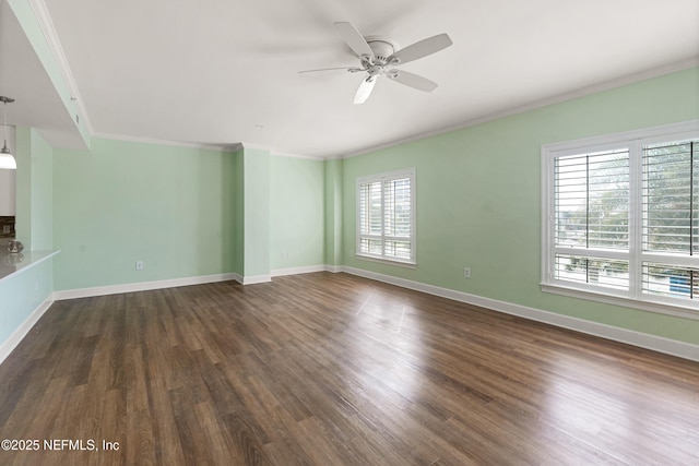 525 3rd St N Unit 303, Jacksonville Beach, FL 32250 - empty room featuring ornamental molding, baseboards, and dark wood-style floors