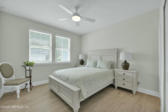 bedroom featuring light wood-style floors, ceiling fan, and baseboards