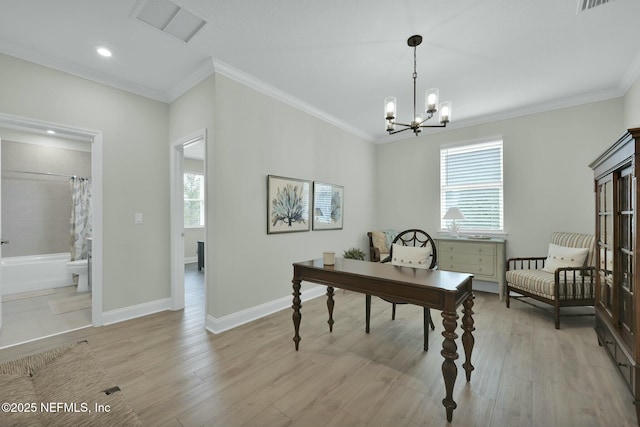 office area featuring ornamental molding, a wealth of natural light, visible vents, and light wood-style floors