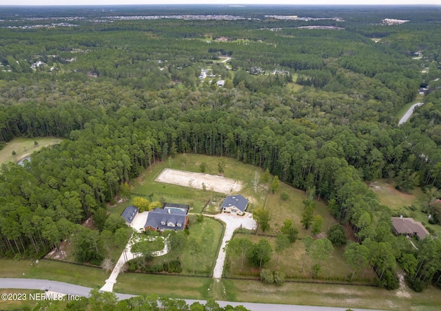 aerial view featuring a view of trees