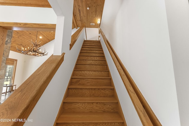 stairs featuring wooden ceiling