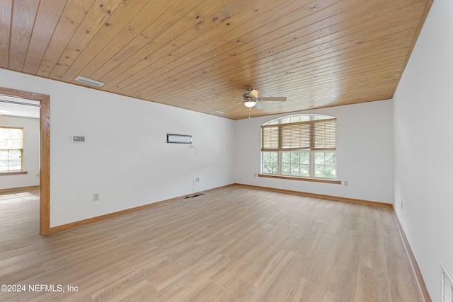 unfurnished room with light wood-style flooring, baseboards, and visible vents