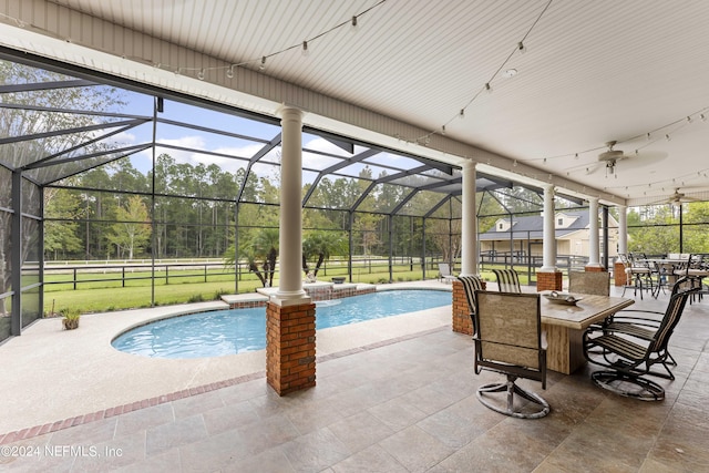 outdoor pool featuring outdoor dining space, ceiling fan, a patio, and a yard