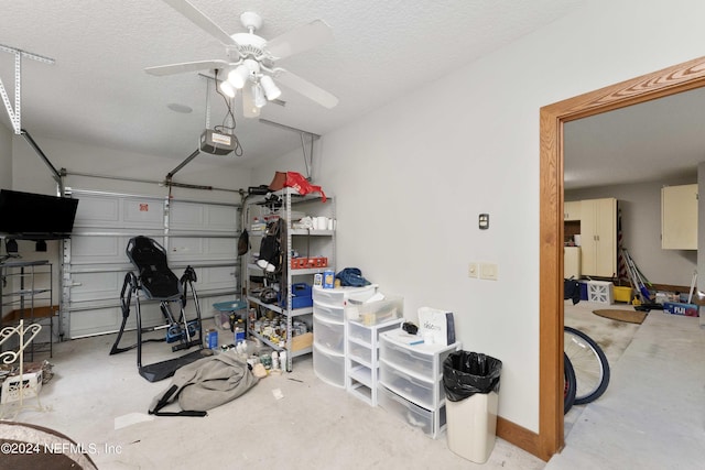 workout area with ceiling fan, baseboards, a garage, and a textured ceiling