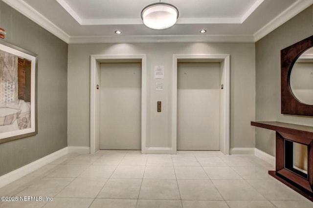 1431 Riverplace Blvd Unit 2606, Jacksonville, FL 32207 - hall with a raised ceiling, elevator, light tile patterned floors, and baseboards