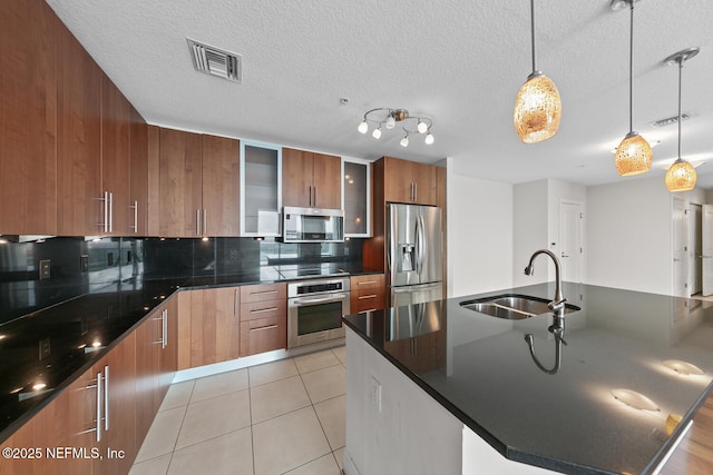 1431 Riverplace Blvd Unit 2606, Jacksonville, FL 32207 - kitchen with visible vents, modern cabinets, stainless steel appliances, a sink, and light tile patterned floors