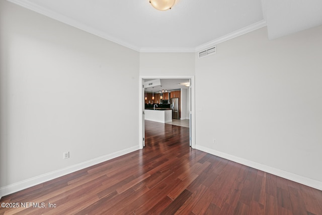 1431 Riverplace Blvd Unit 2606, Jacksonville, FL 32207 - unfurnished room featuring visible vents, baseboards, ornamental molding, wood finished floors, and a sink