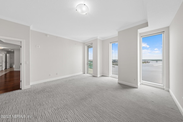 1431 Riverplace Blvd Unit 2606, Jacksonville, FL 32207 - empty room with ornamental molding, light carpet, and baseboards