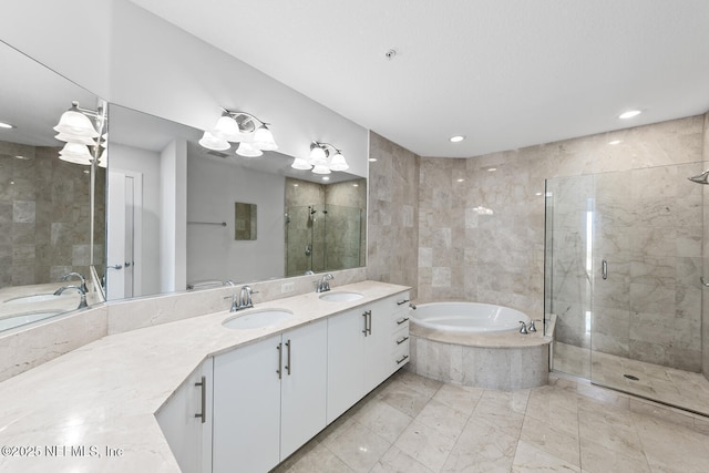 1431 Riverplace Blvd Unit 2606, Jacksonville, FL 32207 - bathroom with double vanity, a sink, a stall shower, and a garden tub
