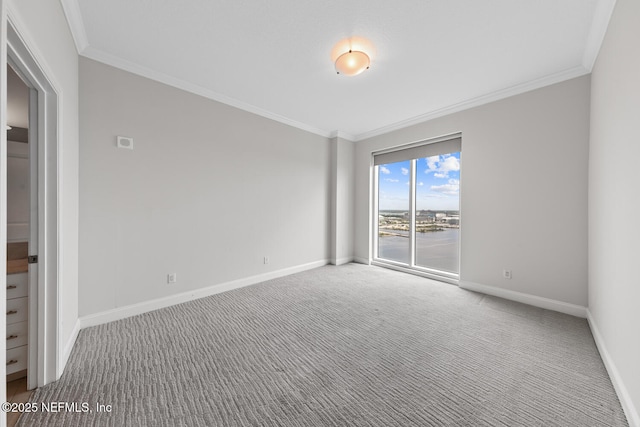 1431 Riverplace Blvd Unit 2606, Jacksonville, FL 32207 - carpeted spare room with baseboards and crown molding