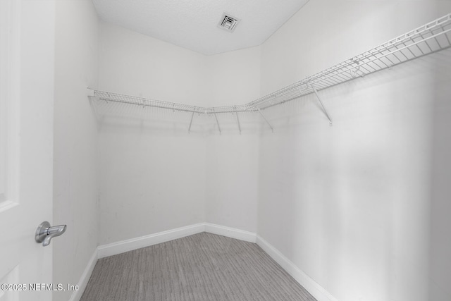 1431 Riverplace Blvd Unit 2606, Jacksonville, FL 32207 - spacious closet featuring carpet floors and visible vents