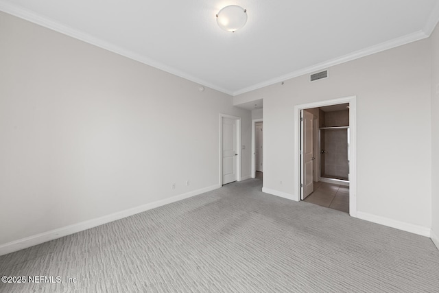 1431 Riverplace Blvd Unit 2606, Jacksonville, FL 32207 - unfurnished bedroom featuring baseboards, visible vents, crown molding, and carpet floors