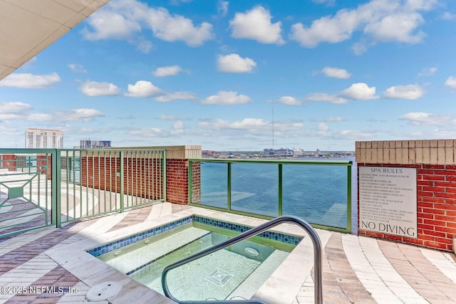1431 Riverplace Blvd Unit 2606, Jacksonville, FL 32207 - view of swimming pool with a city view and a hot tub