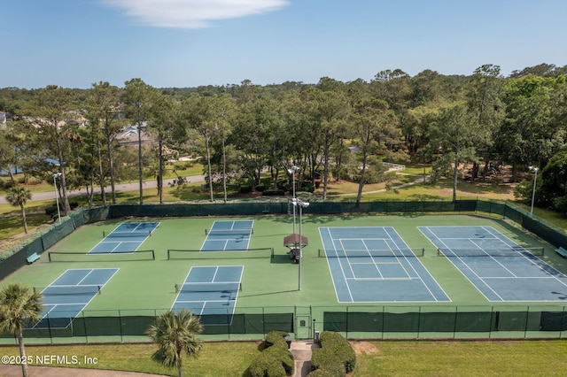 view of tennis court with fence