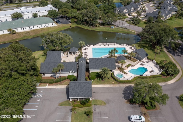 bird's eye view featuring a water view and a residential view