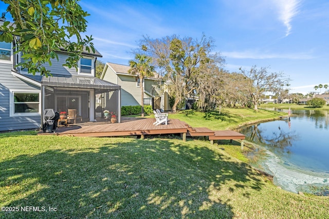 view of yard featuring a deck with water view