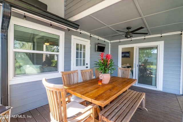 wooden terrace featuring a ceiling fan