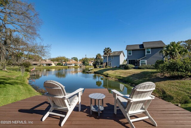 dock area featuring a residential view and a water view