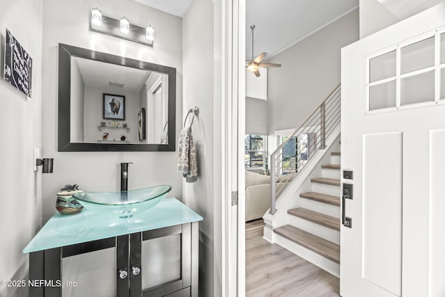 bathroom with vanity, wood finished floors, and a ceiling fan