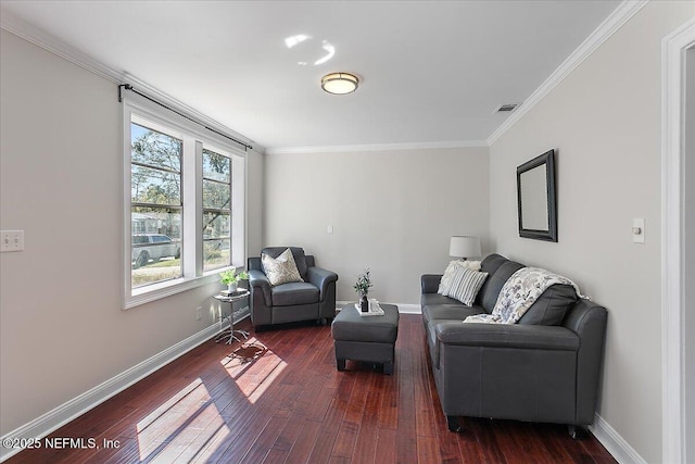 living area with baseboards, dark wood finished floors, and crown molding