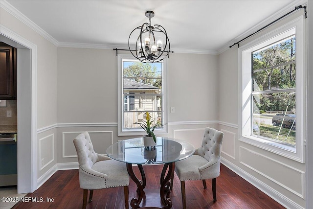 1282 Macarthur St, Jacksonville, FL 32205 - dining area with a notable chandelier, ornamental molding, a decorative wall, and dark wood-type flooring