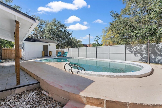 1282 Macarthur St, Jacksonville, FL 32205 - view of pool with an outbuilding, a patio, a fenced backyard, and a fenced in pool