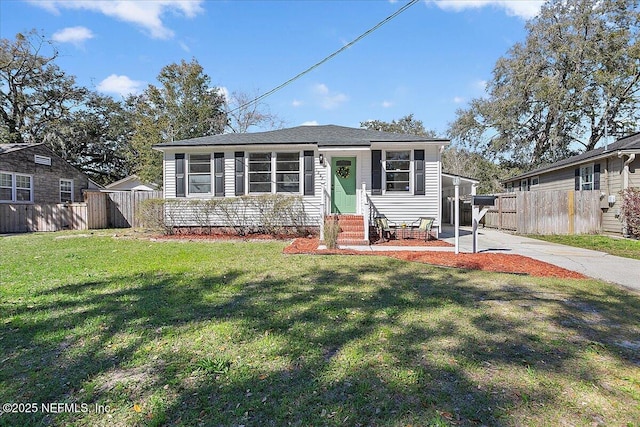 1282 Macarthur St, Jacksonville, FL 32205 - bungalow-style home with entry steps, concrete driveway, a front yard, and fence
