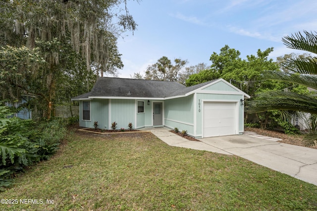 ranch-style house with a garage, driveway, and a front lawn