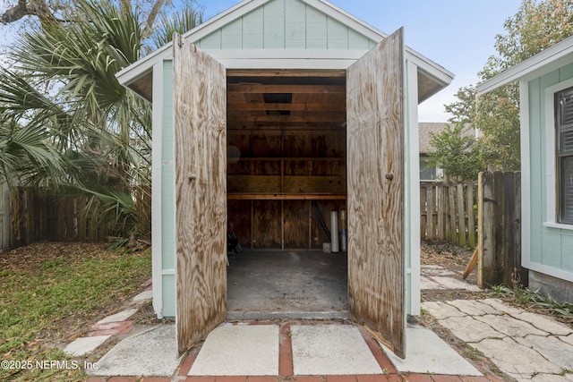 view of shed with fence