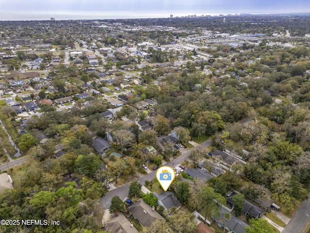 drone / aerial view with a residential view and a water view