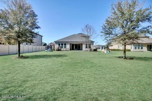 view of yard with fence